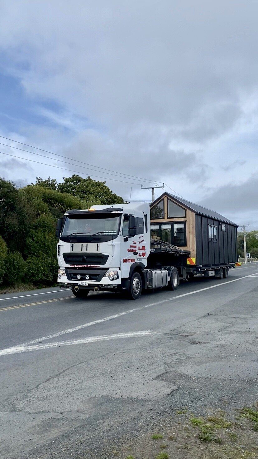 A Raglan Tiny Home on the road, being delivered