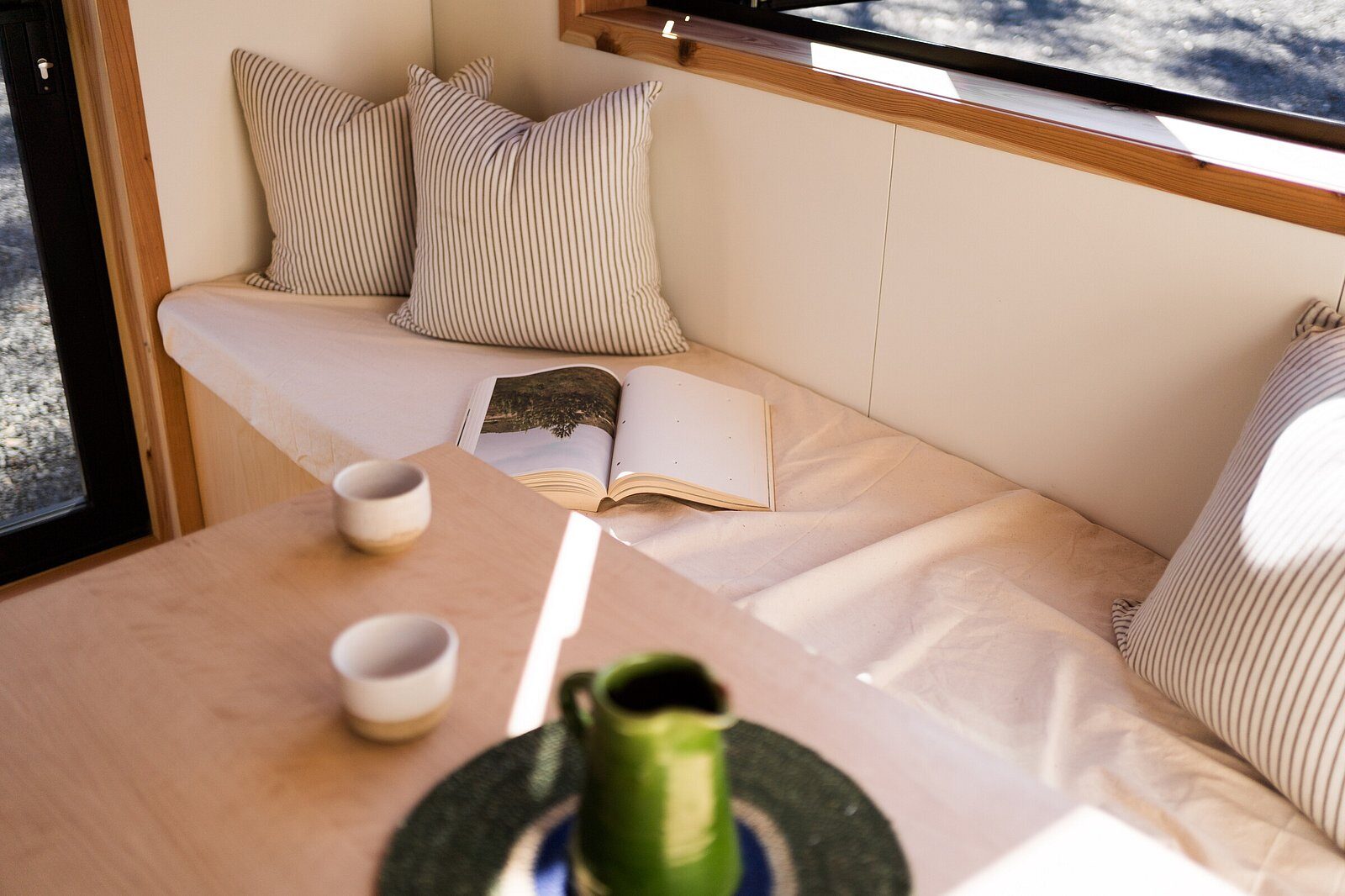 A window seat under a timber ceiling